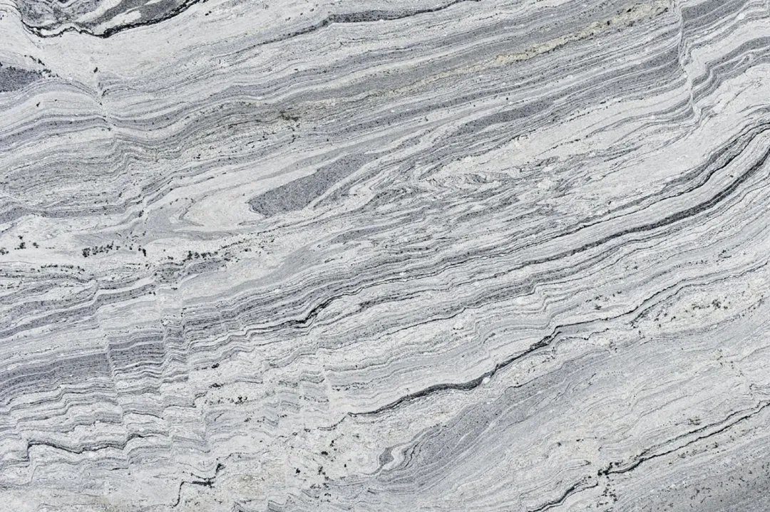 Piracema White Piracema White granite, slab with flowing veins (representative)